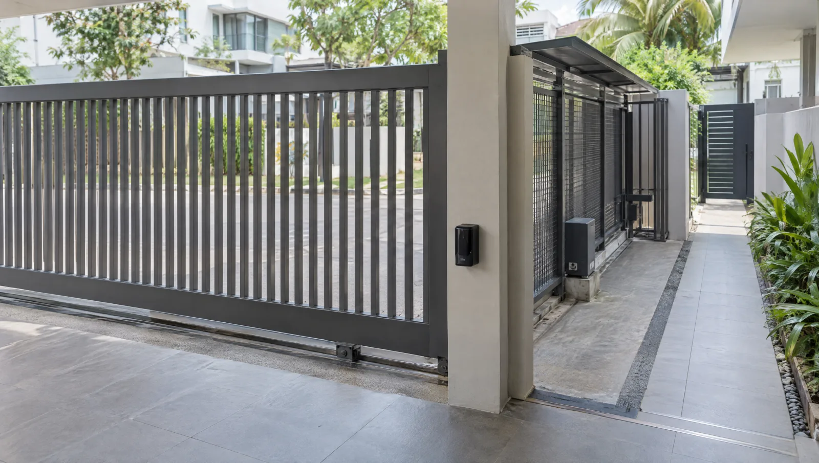Gate photocell in the foreground with the sliding runback and separate pedestrian route beyond.