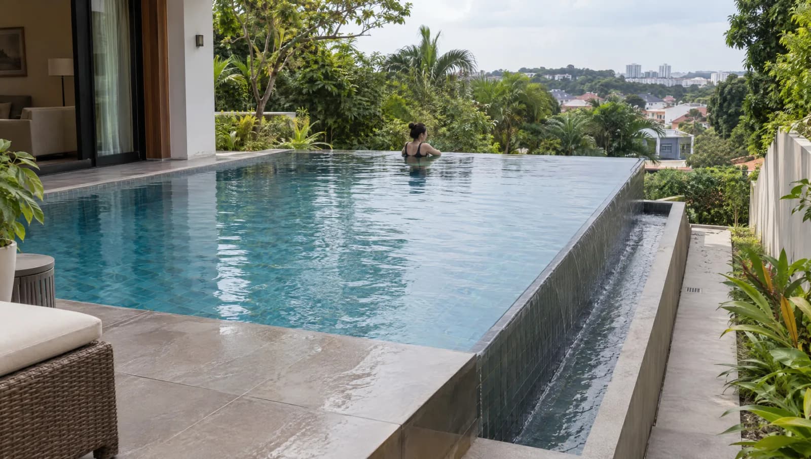 Residential infinity pool with its overflow lip and lower collection trough visible.